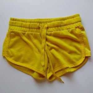 FIVE.BY.FIVE Yellow running shorts